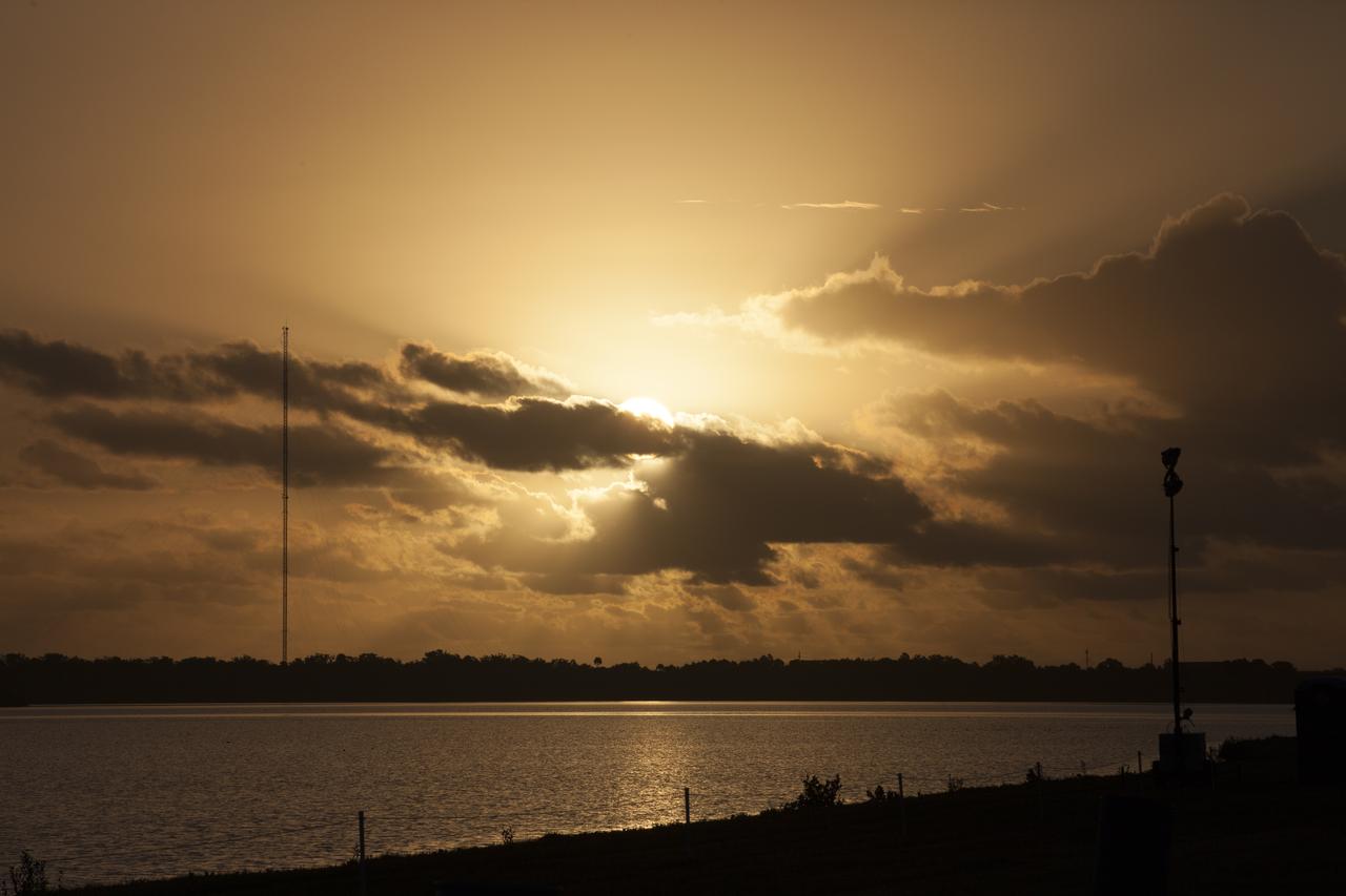 A spectacular sunrise at NASA's Kennedy Space Center in Florida heralds the arrival of a new era in exploration a day before the launch of a United Launch Alliance Delta IV Heavy topped by the agency's Orion spacecraft for its first flight test.