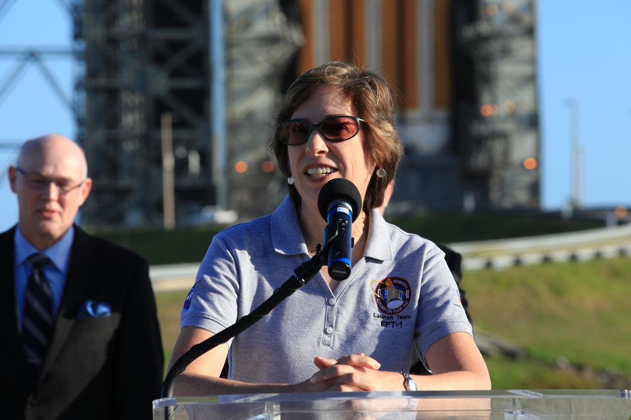 At Cape Canaveral Air Force Station's Launch Complex 37, Johnson Space Center Director Ellen Ochoa speaks to members of the news media as the Orion spacecraft and its United Launch Alliance Delta IV Heavy rocket were being prepared for launch. Behind Ochoa is United Launch Alliance CEO Tory Bruno.