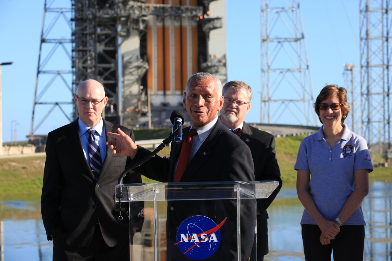 At Cape Canaveral Air Force Station's Launch Complex 37, NASA Administrator Charlie Bolden speaks to members of the news media as the Orion spacecraft and its United Launch Alliance Delta IV Heavy rocket were being prepared for launch. Behind Bolden, from the left, are United Launch Alliance CEO Tory Bruno, Lockheed Martin Orion Program manager Mike Hawes and Johnson Space Center Director Ellen Ochoa.