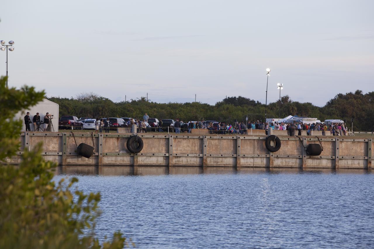 At NASA's Kennedy Space Center in Florida, news media and other guests gather in anticipation of the launch of NASA's Orion spacecraft atop a United Launch Alliance Delta IV Heavy rocket. 