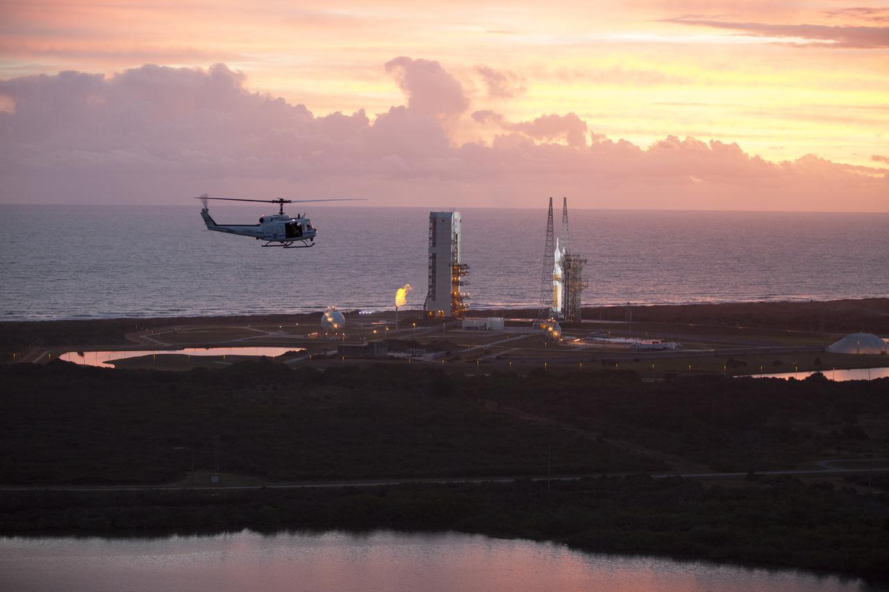 This helicopter view of Space Launch Complex 37 at Cape Canaveral Air Force Station in Florida shows the United Launch Alliance Delta IV Heavy rocket as it stands ready to boost NASA's Orion spacecraft on a 4.5-hour mission. The liftoff was postponed because of an issue related to fill and drain valves on the Delta IV Heavy rocket that teams could not troubleshoot by the time the launch window expired