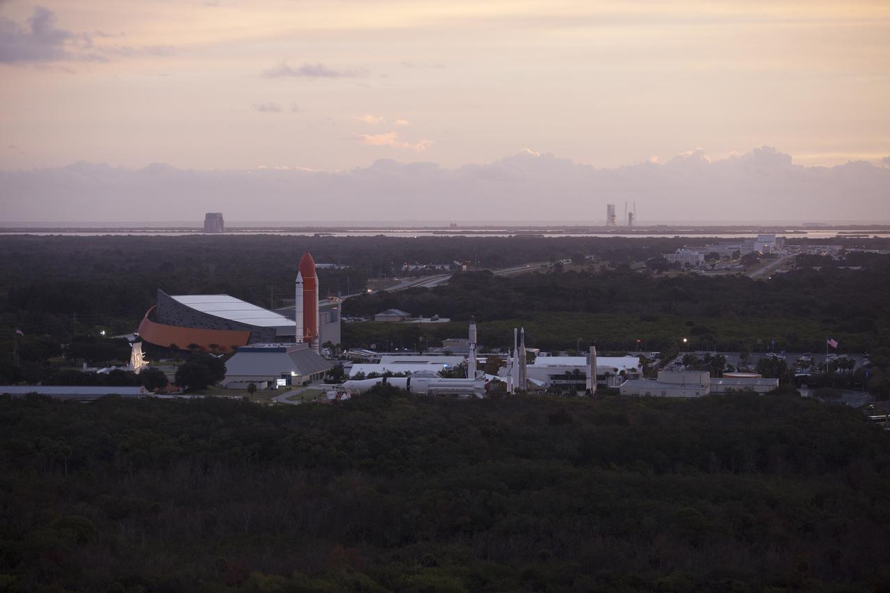 This helicopter view of the Kennedy Space Center Visitor Complex shows the thousands of vehicles parked where guests gather to see the launch of the Orion Flight Test. The liftoff was postponed because of an issue related to fill and drain valves on the Delta IV Heavy rocket that teams could not troubleshoot by the time the launch window expired. 