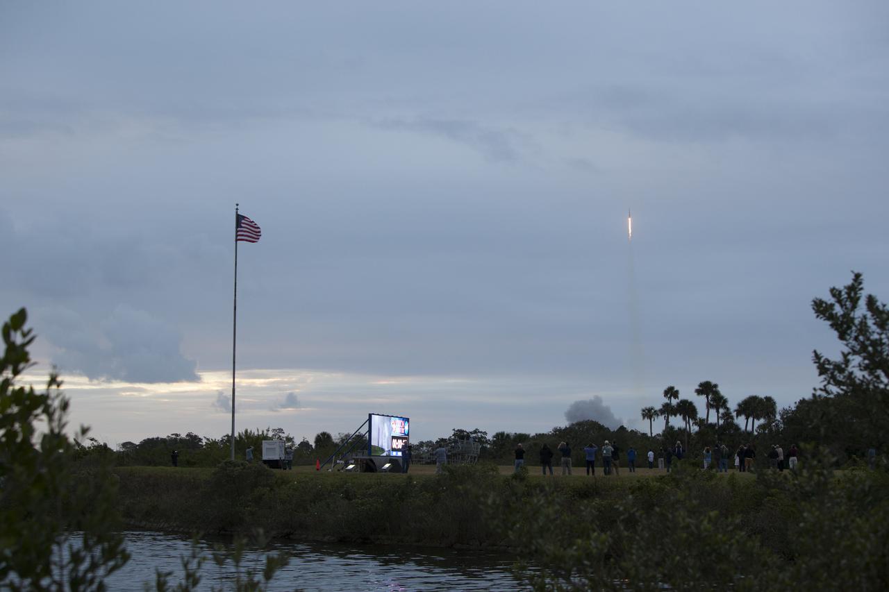 A Delta IV Heavy rocket lifts off from Space Launch Complex 37 at Cape Canaveral Air Force Station in Florida carrying NASA's Orion spacecraft on an unpiloted flight test to Earth orbit. In the foreground is the newly upgraded countdown clock at the spaceport's Press Site. Liftoff was at 7:05 a.m. EST. During the two-orbit, four-and-a-half hour mission, engineers will evaluate the systems critical to crew safety, the launch abort system, the heat shield and the parachute system. 