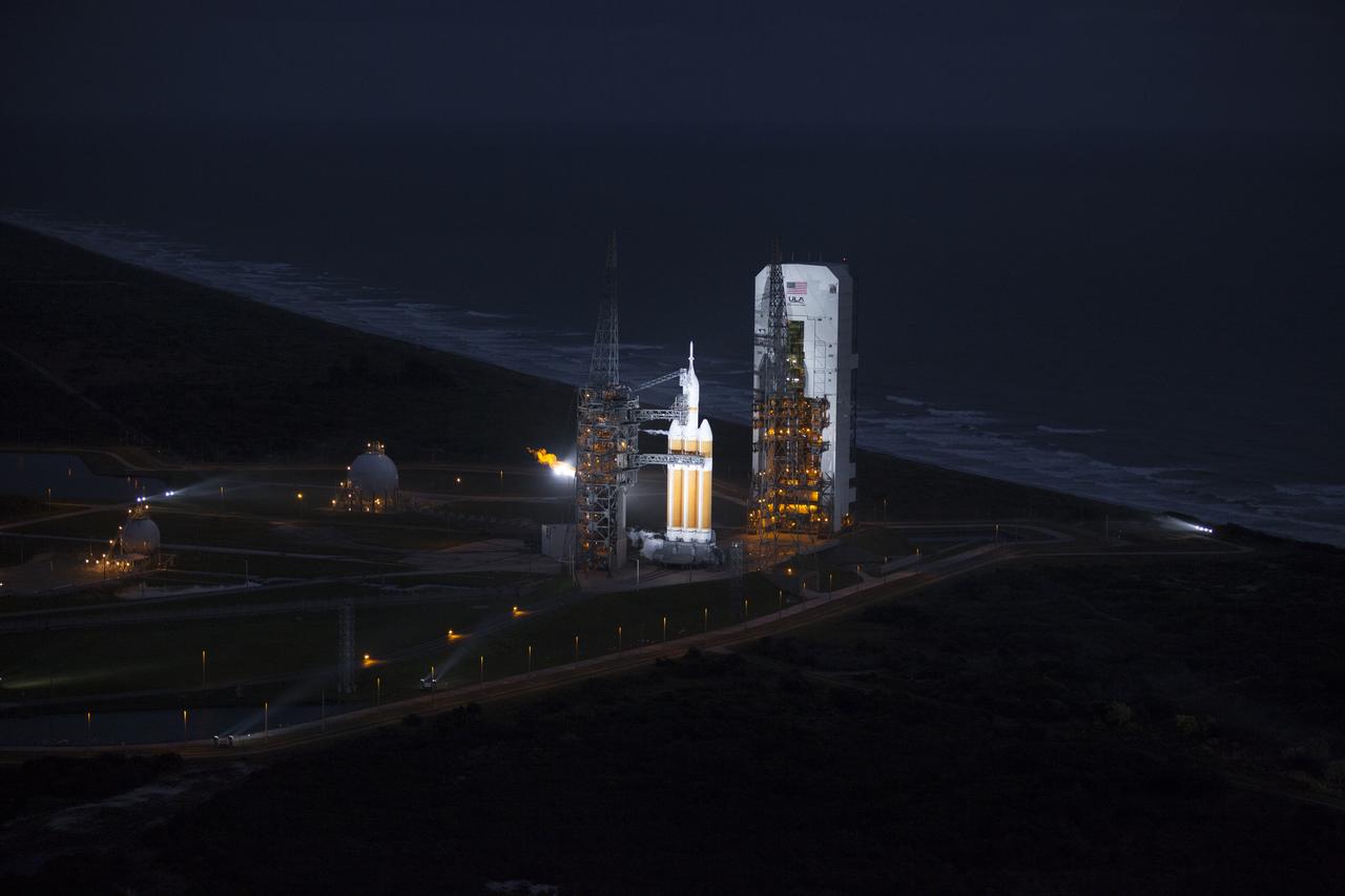This helicopter view of Space Launch Complex 37 at Cape Canaveral Air Force Station in Florida shows the United Launch Alliance Delta IV Heavy rocket as it stands ready to boost NASA's Orion spacecraft on a 4.5-hour mission.