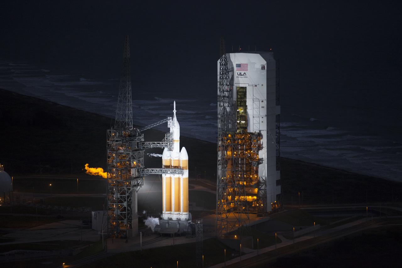 This helicopter view of Space Launch Complex 37 at Cape Canaveral Air Force Station in Florida shows the United Launch Alliance Delta IV Heavy rocket as it stands ready to boost NASA's Orion spacecraft on a 4.5-hour mission.