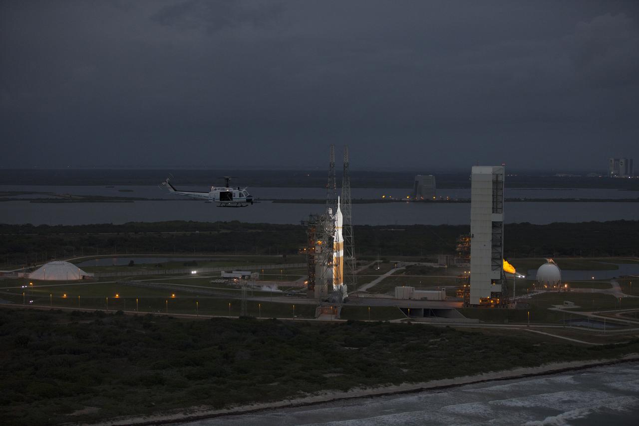 This helicopter view of Space Launch Complex 37 at Cape Canaveral Air Force Station in Florida shows the United Launch Alliance Delta IV Heavy rocket as it stands ready to boost NASA's Orion spacecraft on a 4.5-hour mission.