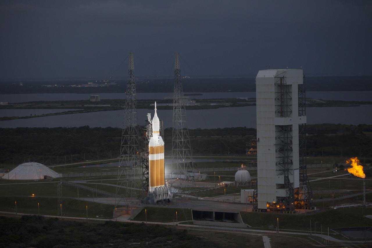 This helicopter view of Space Launch Complex 37 at Cape Canaveral Air Force Station in Florida shows the United Launch Alliance Delta IV Heavy rocket as it stands ready to boost NASA's Orion spacecraft on a 4.5-hour mission.