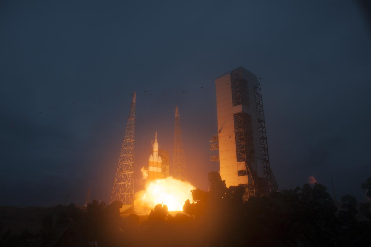 A Delta IV Heavy rocket lifts off from Space Launch Complex 37 at Cape Canaveral Air Force Station in Florida carrying NASA's Orion spacecraft on an unpiloted flight test to Earth orbit. Liftoff was at 7:05 a.m. EST. During the two-orbit, four-and-a-half hour mission, engineers will evaluate the systems critical to crew safety, the launch abort system, the heat shield and the parachute system.