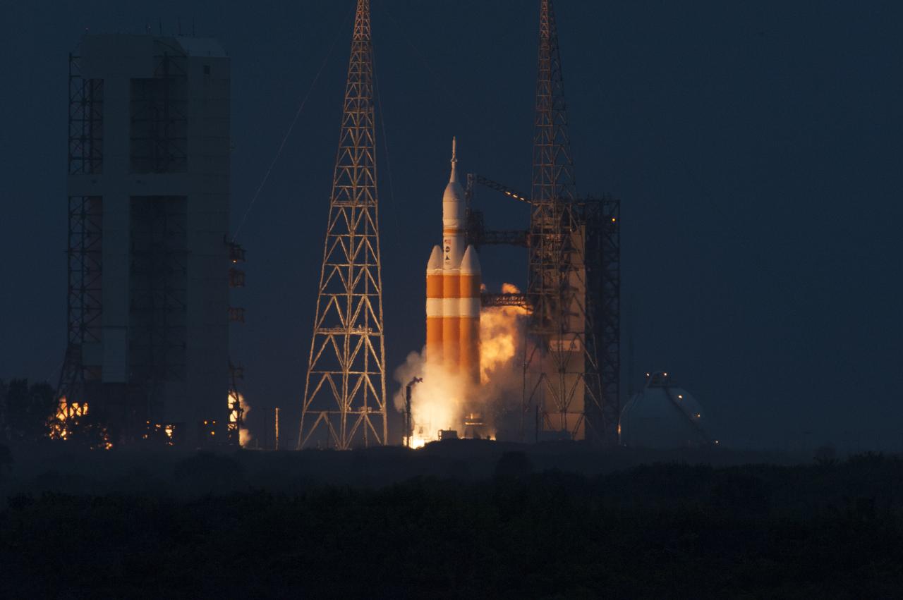 A Delta IV Heavy rocket roars to life at Space Launch Complex 37 at Cape Canaveral Air Force Station in Florida. The launch vehicle is carrying NASA's Orion spacecraft on an unpiloted flight test to Earth orbit. Liftoff was at 7:05 a.m. EST. The flight will send Orion 3,600 miles in altitude beyond the Earth's surface on a four-and-a-half hour mission.