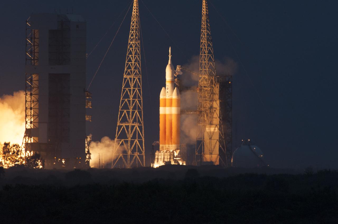 A Delta IV Heavy rocket roars to life at Space Launch Complex 37 at Cape Canaveral Air Force Station in Florida. The launch vehicle is carrying NASA's Orion spacecraft on an unpiloted flight test to Earth orbit. Liftoff was at 7:05 a.m. EST. The flight will send Orion 3,600 miles in altitude beyond the Earth's surface on a four-and-a-half hour mission.