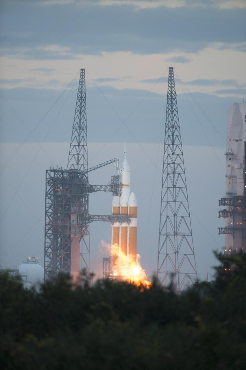 A Delta IV Heavy rocket lifts off from Space Launch Complex 37 at Cape Canaveral Air Force Station in Florida carrying NASA's Orion spacecraft on an unpiloted flight test to Earth orbit. Liftoff was at 7:05 a.m. EST. During the two-orbit, four-and-a-half hour mission, engineers will evaluate the systems critical to crew safety, the launch abort system, the heat shield and the parachute system.