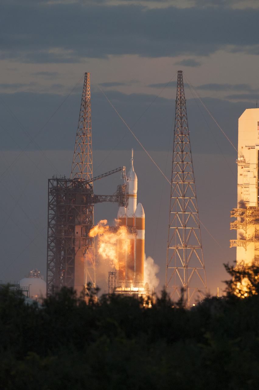 A Delta IV Heavy rocket lifts off from Space Launch Complex 37 at Cape Canaveral Air Force Station in Florida carrying NASA's Orion spacecraft on an unpiloted flight test to Earth orbit. Liftoff was at 7:05 a.m. EST. During the two-orbit, four-and-a-half hour mission, engineers will evaluate the systems critical to crew safety, the launch abort system, the heat shield and the parachute system.