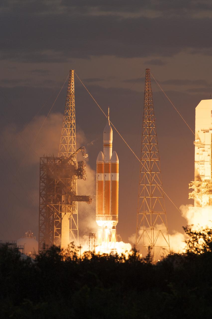 A Delta IV Heavy rocket lifts off from Space Launch Complex 37 at Cape Canaveral Air Force Station in Florida carrying NASA's Orion spacecraft on an unpiloted flight test to Earth orbit. Liftoff was at 7:05 a.m. EST. During the two-orbit, four-and-a-half hour mission, engineers will evaluate the systems critical to crew safety, the launch abort system, the heat shield and the parachute system.