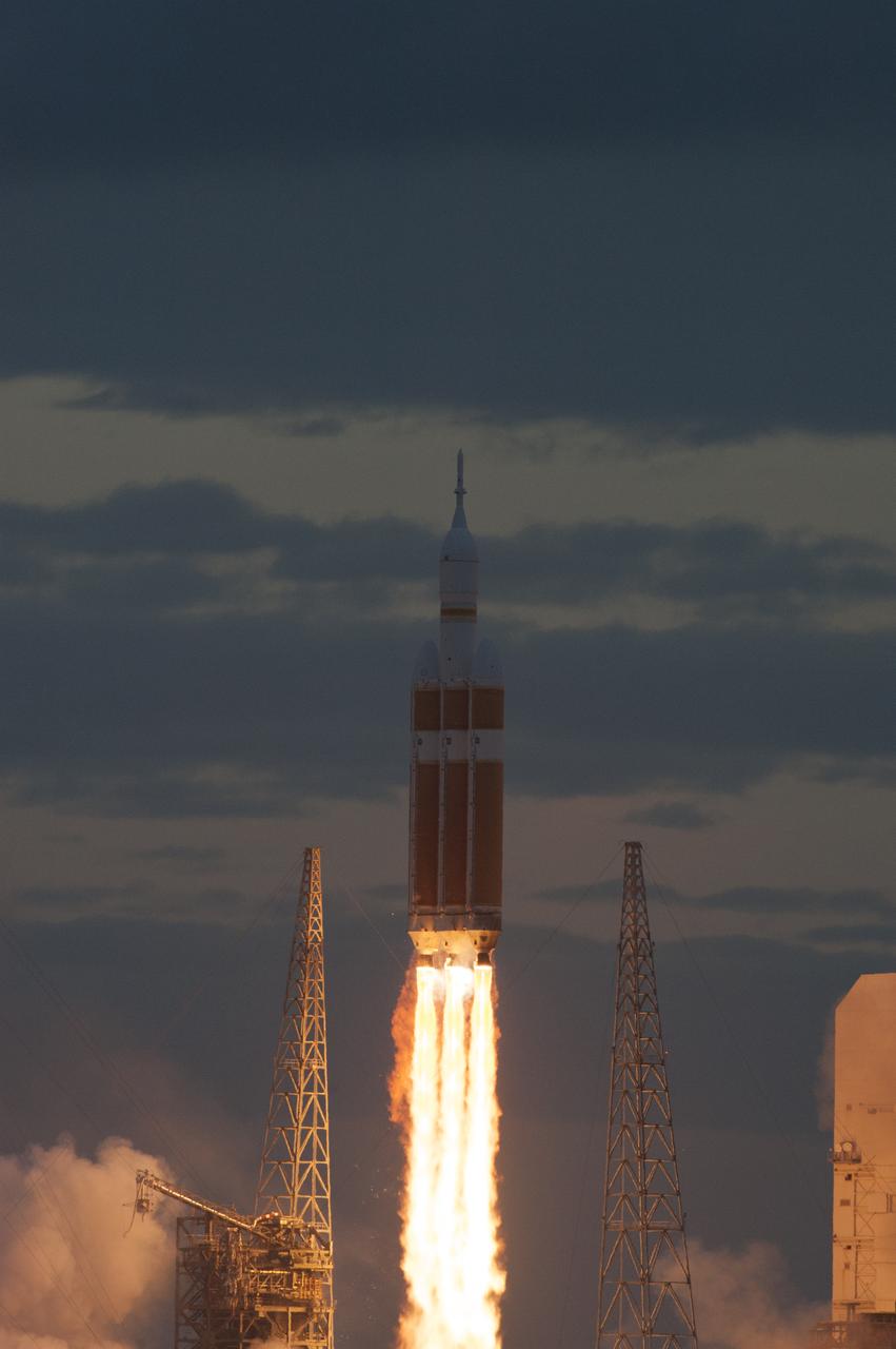 A Delta IV Heavy rocket lifts off from Space Launch Complex 37 at Cape Canaveral Air Force Station in Florida carrying NASA's Orion spacecraft on an unpiloted flight test to Earth orbit. Liftoff was at 7:05 a.m. EST. During the two-orbit, four-and-a-half hour mission, engineers will evaluate the systems critical to crew safety, the launch abort system, the heat shield and the parachute system.