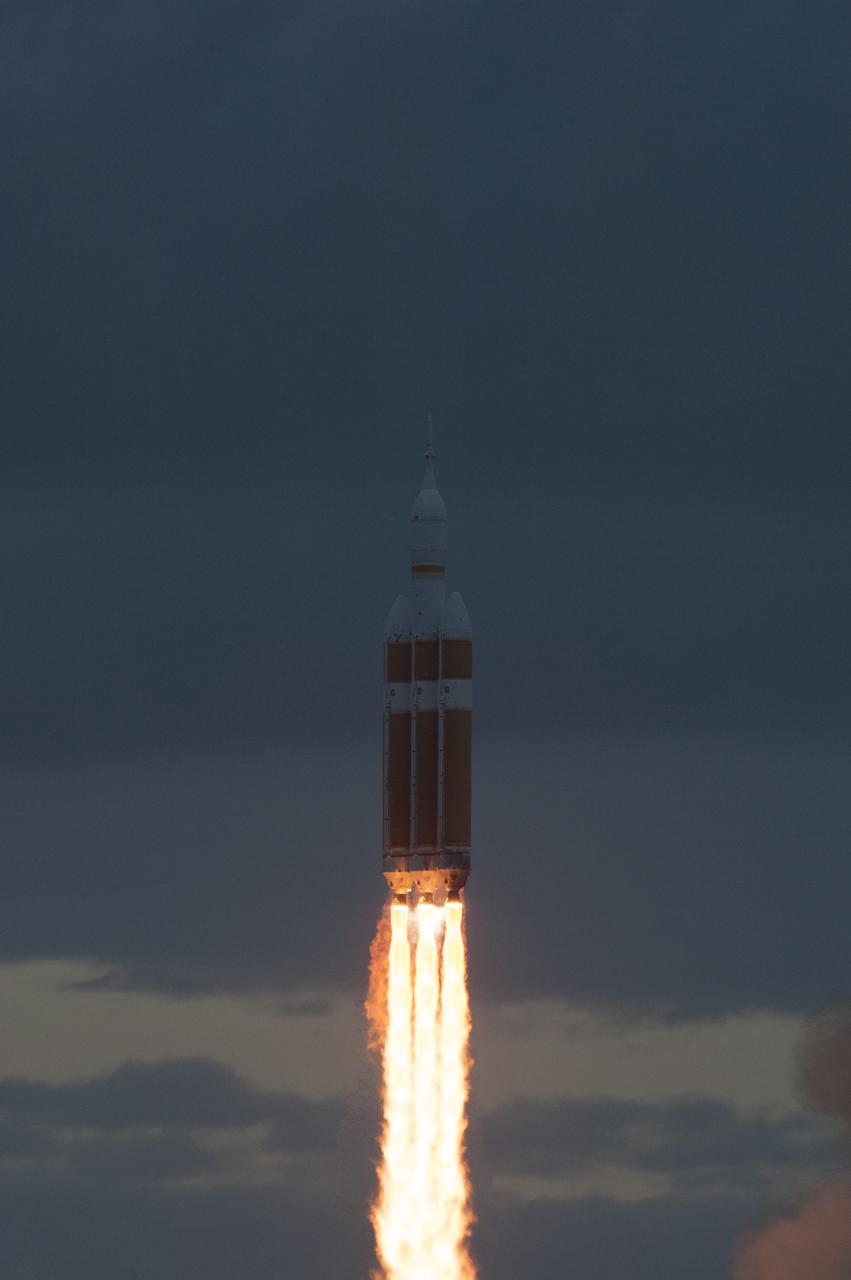 A Delta IV Heavy rocket lifts off from Space Launch Complex 37 at Cape Canaveral Air Force Station in Florida carrying NASA's Orion spacecraft on an unpiloted flight test to Earth orbit. Liftoff was at 7:05 a.m. EST. During the two-orbit, four-and-a-half hour mission, engineers will evaluate the systems critical to crew safety, the launch abort system, the heat shield and the parachute system.