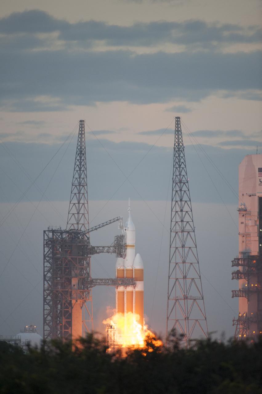 A Delta IV Heavy rocket lifts off from Space Launch Complex 37 at Cape Canaveral Air Force Station in Florida carrying NASA's Orion spacecraft on an unpiloted flight test to Earth orbit. Liftoff was at 7:05 a.m. EST. During the two-orbit, four-and-a-half hour mission, engineers will evaluate the systems critical to crew safety, the launch abort system, the heat shield and the parachute system.