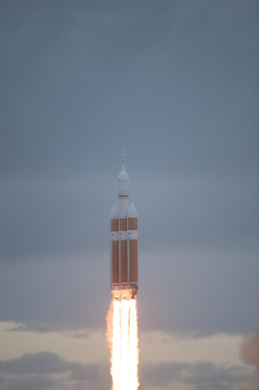 A Delta IV Heavy rocket lifts off from Space Launch Complex 37 at Cape Canaveral Air Force Station in Florida carrying NASA's Orion spacecraft on an unpiloted flight test to Earth orbit. Liftoff was at 7:05 a.m. EST. During the two-orbit, four-and-a-half hour mission, engineers will evaluate the systems critical to crew safety, the launch abort system, the heat shield and the parachute system.