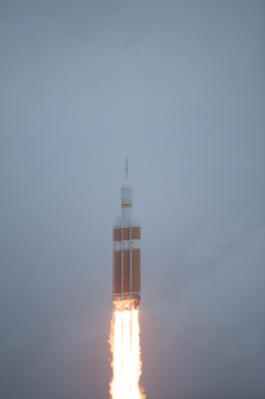 A Delta IV Heavy rocket lifts off from Space Launch Complex 37 at Cape Canaveral Air Force Station in Florida carrying NASA's Orion spacecraft on an unpiloted flight test to Earth orbit. Liftoff was at 7:05 a.m. EST. During the two-orbit, four-and-a-half hour mission, engineers will evaluate the systems critical to crew safety, the launch abort system, the heat shield and the parachute system.