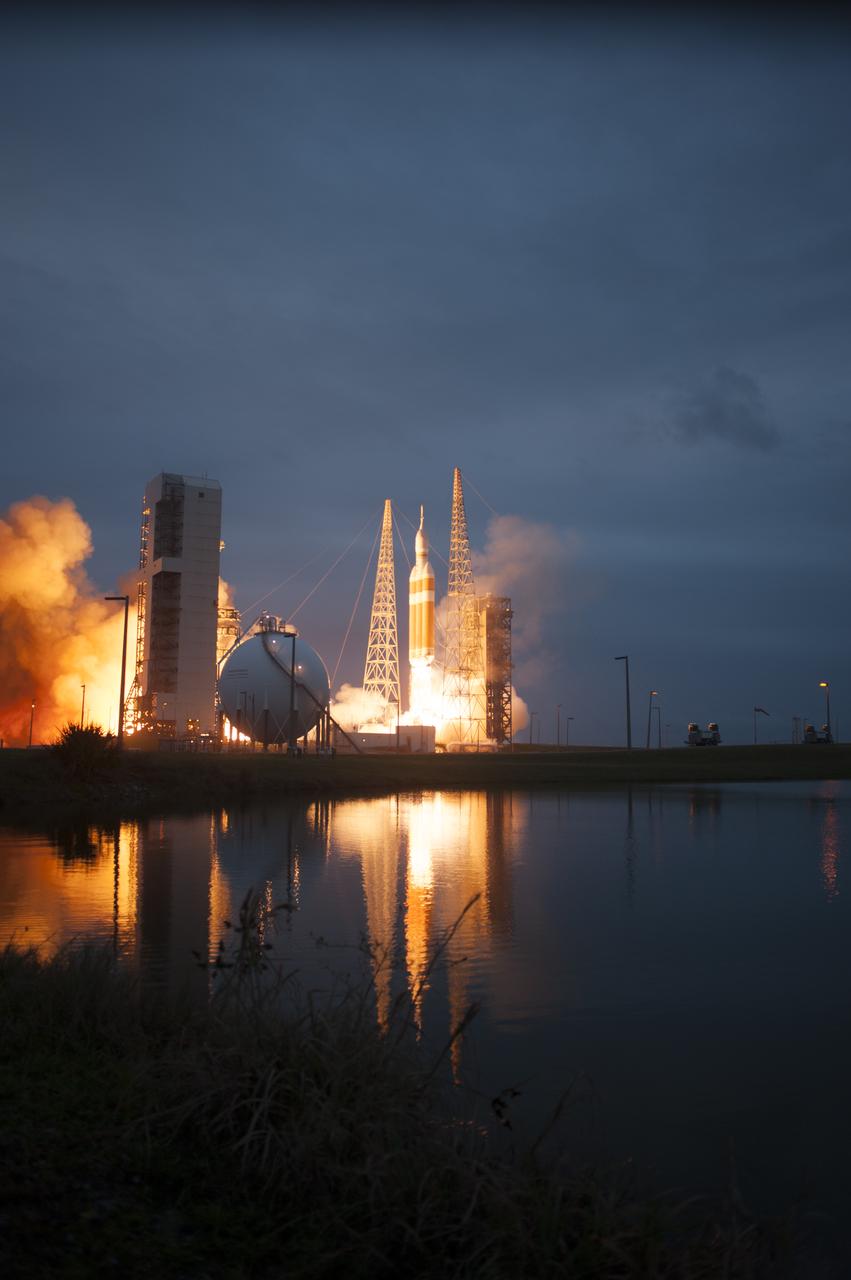 A Delta IV Heavy rocket lifts off from Space Launch Complex 37 at Cape Canaveral Air Force Station in Florida carrying NASA's Orion spacecraft on an unpiloted flight test to Earth orbit. Liftoff was at 7:05 a.m. EST. During the two-orbit, four-and-a-half hour mission, engineers will evaluate the systems critical to crew safety, the launch abort system, the heat shield and the parachute system.