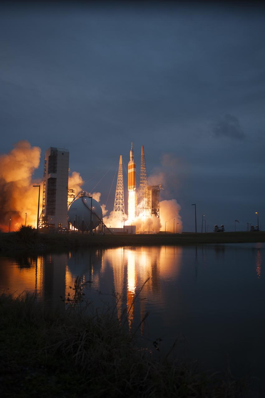 A Delta IV Heavy rocket lifts off from Space Launch Complex 37 at Cape Canaveral Air Force Station in Florida carrying NASA's Orion spacecraft on an unpiloted flight test to Earth orbit. Liftoff was at 7:05 a.m. EST. During the two-orbit, four-and-a-half hour mission, engineers will evaluate the systems critical to crew safety, the launch abort system, the heat shield and the parachute system.