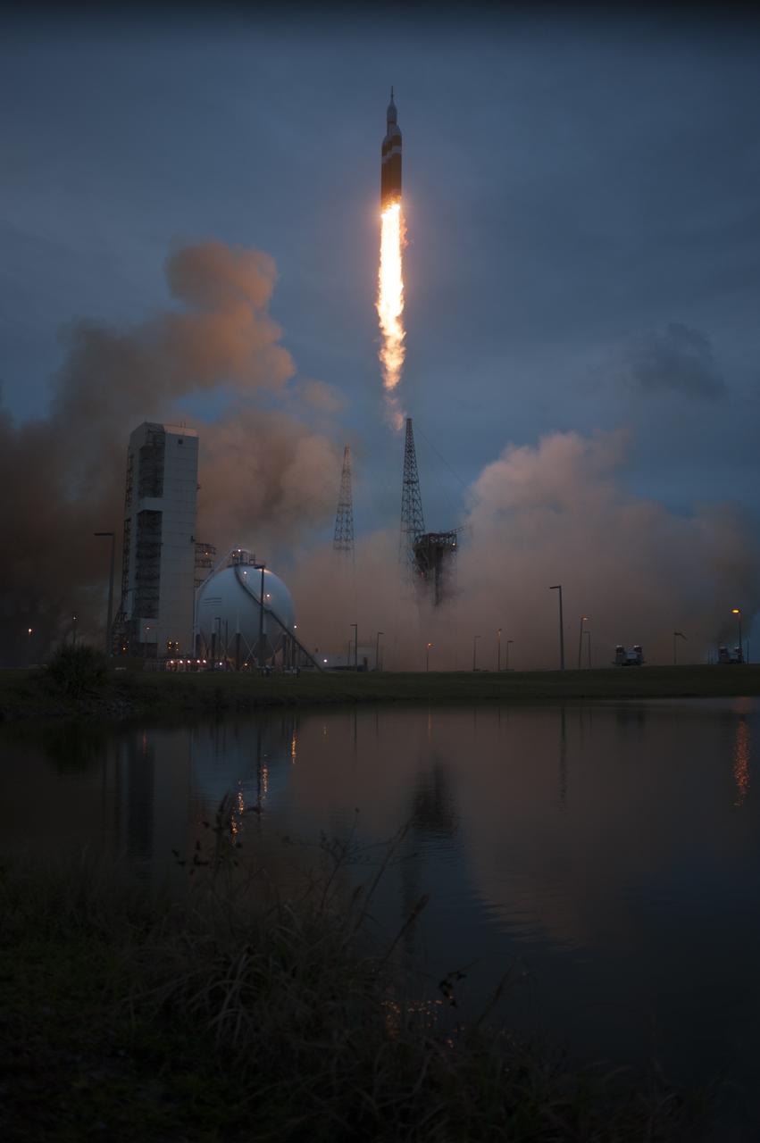 A Delta IV Heavy rocket lifts off from Space Launch Complex 37 at Cape Canaveral Air Force Station in Florida carrying NASA's Orion spacecraft on an unpiloted flight test to Earth orbit. Liftoff was at 7:05 a.m. EST. During the two-orbit, four-and-a-half hour mission, engineers will evaluate the systems critical to crew safety, the launch abort system, the heat shield and the parachute system.