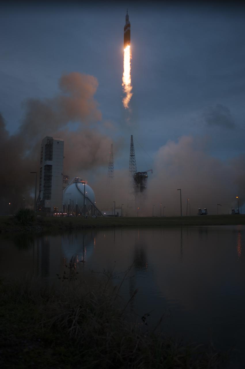 A Delta IV Heavy rocket lifts off from Space Launch Complex 37 at Cape Canaveral Air Force Station in Florida carrying NASA's Orion spacecraft on an unpiloted flight test to Earth orbit. Liftoff was at 7:05 a.m. EST. During the two-orbit, four-and-a-half hour mission, engineers will evaluate the systems critical to crew safety, the launch abort system, the heat shield and the parachute system.