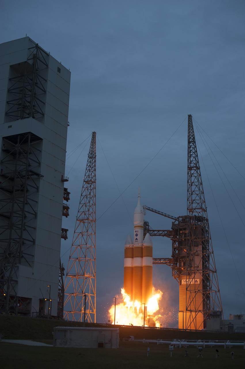 A Delta IV Heavy rocket lifts off from Space Launch Complex 37 at Cape Canaveral Air Force Station in Florida carrying NASA's Orion spacecraft on an unpiloted flight test to Earth orbit. Liftoff was at 7:05 a.m. EST. During the two-orbit, four-and-a-half hour mission, engineers will evaluate the systems critical to crew safety, the launch abort system, the heat shield and the parachute system.