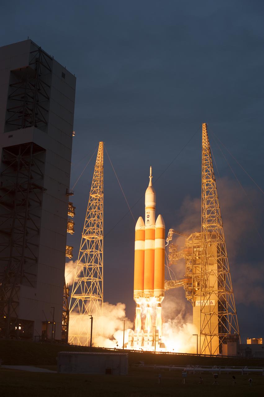 A Delta IV Heavy rocket lifts off from Space Launch Complex 37 at Cape Canaveral Air Force Station in Florida carrying NASA's Orion spacecraft on an unpiloted flight test to Earth orbit. Liftoff was at 7:05 a.m. EST. During the two-orbit, four-and-a-half hour mission, engineers will evaluate the systems critical to crew safety, the launch abort system, the heat shield and the parachute system.