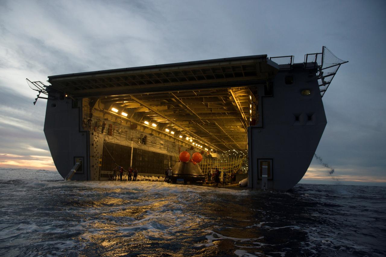 The Orion crew module is recovered after splashdown in the Pacific Ocean about 600 miles off the coast of San Diego, California. NASA, the U.S. Navy and Lockheed Martin coordinated efforts to recover Orion and secure the spacecraft inside the well deck of the USS Anchorage. After lifting off at 7:05 a.m. EST atop a Delta IV Heavy rocket from Space Launch Complex 37 at Cape Canaveral Air Force Station in Florida, NASA's Orion spacecraft completed a two-orbit, four-and-a-half hour mission to test systems critical to crew safety, including the launch abort system, the heat shield and the parachute system. The Ground Systems Development and Operations Program is leading the recovery efforts.