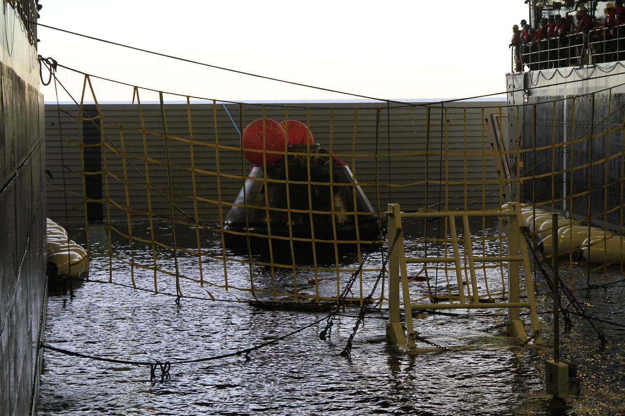 NASA's Orion spacecraft has been recovered inside the flooded well deck of the USS Anchorage in the Pacific Ocean about 600 miles off the coast of San Diego, California. After lifting off at 7:05 a.m. EST atop a Delta IV Heavy rocket from Space Launch Complex 37 at Cape Canaveral Air Force Station in Florida, Orion completed a two-orbit, four-and-a-half hour mission to test systems critical to crew safety, including the launch abort system, the heat shield and the parachute system. NASA, the U.S. Navy and Lockheed Martin coordinated efforts to recover Orion after splashdown. The Ground Systems Development and Operations Program is leading the recovery efforts. 
