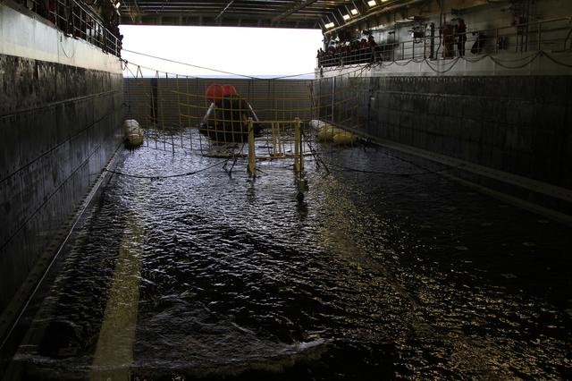 NASA image: Orion in the Well Deck After Splashdown and Recovery