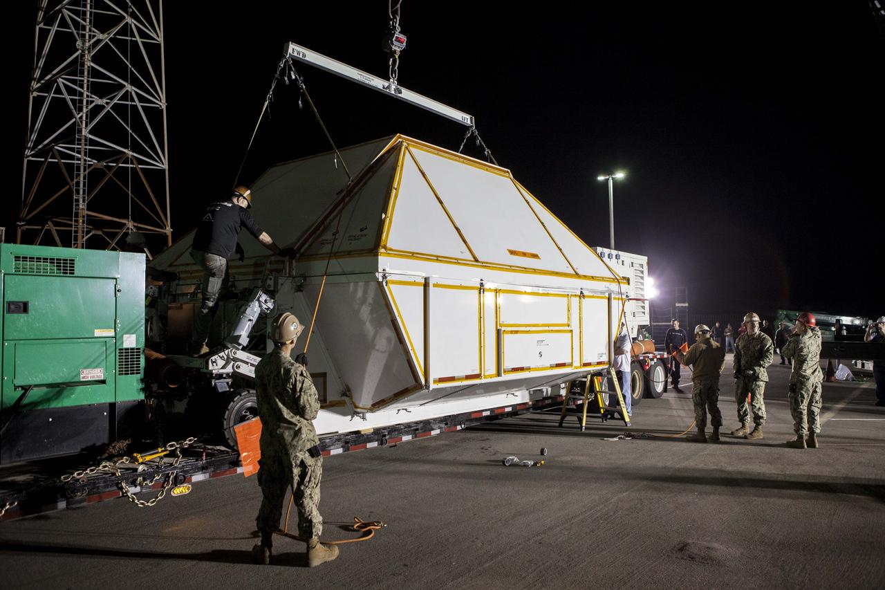 The Orion crew module has been secured in the crew module transportation fixture at the Mole Pier at Naval Base San Diego in California. The fixture has been secured on the back of a flatbed truck and the cover has been lowered over the spacecraft. Orion is being prepared for the overland trip back to NASA's Kennedy Space Center in Florida. Orion was recovered from the Pacific Ocean after completing a two-orbit, four-and-a-half hour mission Dec. 5 to test systems critical to crew safety, including the launch abort system, the heat shield and the parachute system. NASA, the U.S. Navy and Lockheed Martin coordinated efforts to recover Orion. The Ground Systems Development and Operations Program led the recovery, offload and pre-transportation efforts.
