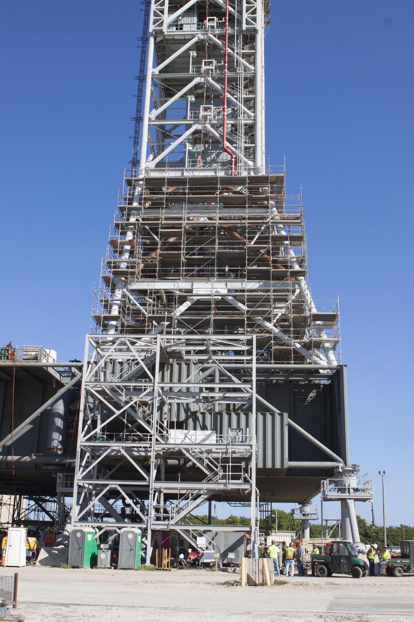 Modifications continue on the Mobile Launcher, or ML, at the Mobile Launcher Park Site at NASA’s Kennedy Space Center in Florida. Scaffolding, or work platforms, have been installed around the base of the tower on the ML to continue upgrades and modifications to the structure. The ML is being modified and strengthened to accommodate the weight, size and thrust at launch of NASA's Space Launch System, or SLS, and Orion spacecraft. The ML is one of the key elements of ground support equipment that is being upgraded by the Ground Systems Development and Operations Program at Kennedy. The ML will carry the SLS rocket and Orion spacecraft to Launch Pad 39B for its first uncrewed mission, Exploration Mission-1, in 2018. 