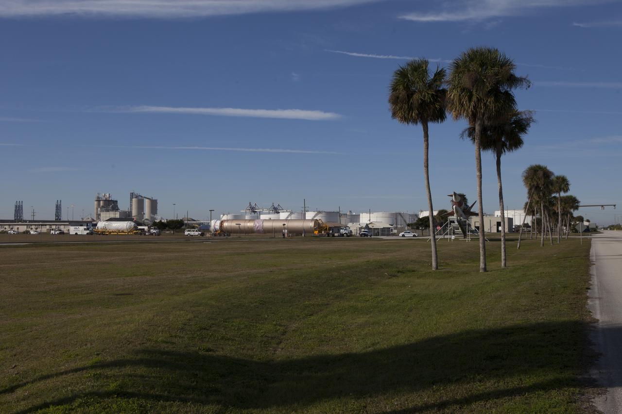 Trucks transport the Atlas V rocket and Centaur upper stage from the United Launch Alliance Delta Mariner to the Atlas V Spaceflight Operations Center at Cape Canaveral Air Force Station. The rocket will be used to launch NASA's Magnetospheric Multiscale mission.