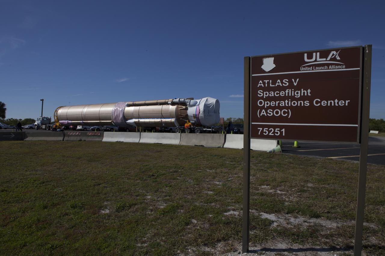 Trucks transport the Atlas V rocket and Centaur upper stage from the United Launch Alliance Delta Mariner to the Atlas V Spaceflight Operations Center at Cape Canaveral Air Force Station. The rocket will be used to launch NASA's Magnetospheric Multiscale mission.