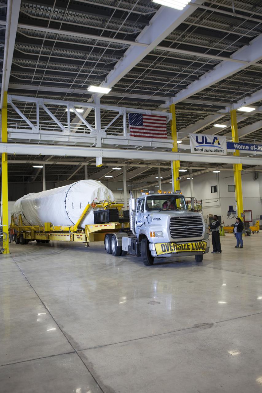 A truck positions a Centaur upper stage inside the hangar at the Atlas V Spaceflight Operations Center at Cape Canaveral Air Force Station. The upper stage will be used as part of the Atlas V rocket that will be used to launch NASA's Magnetospheric Multiscale mission. 
