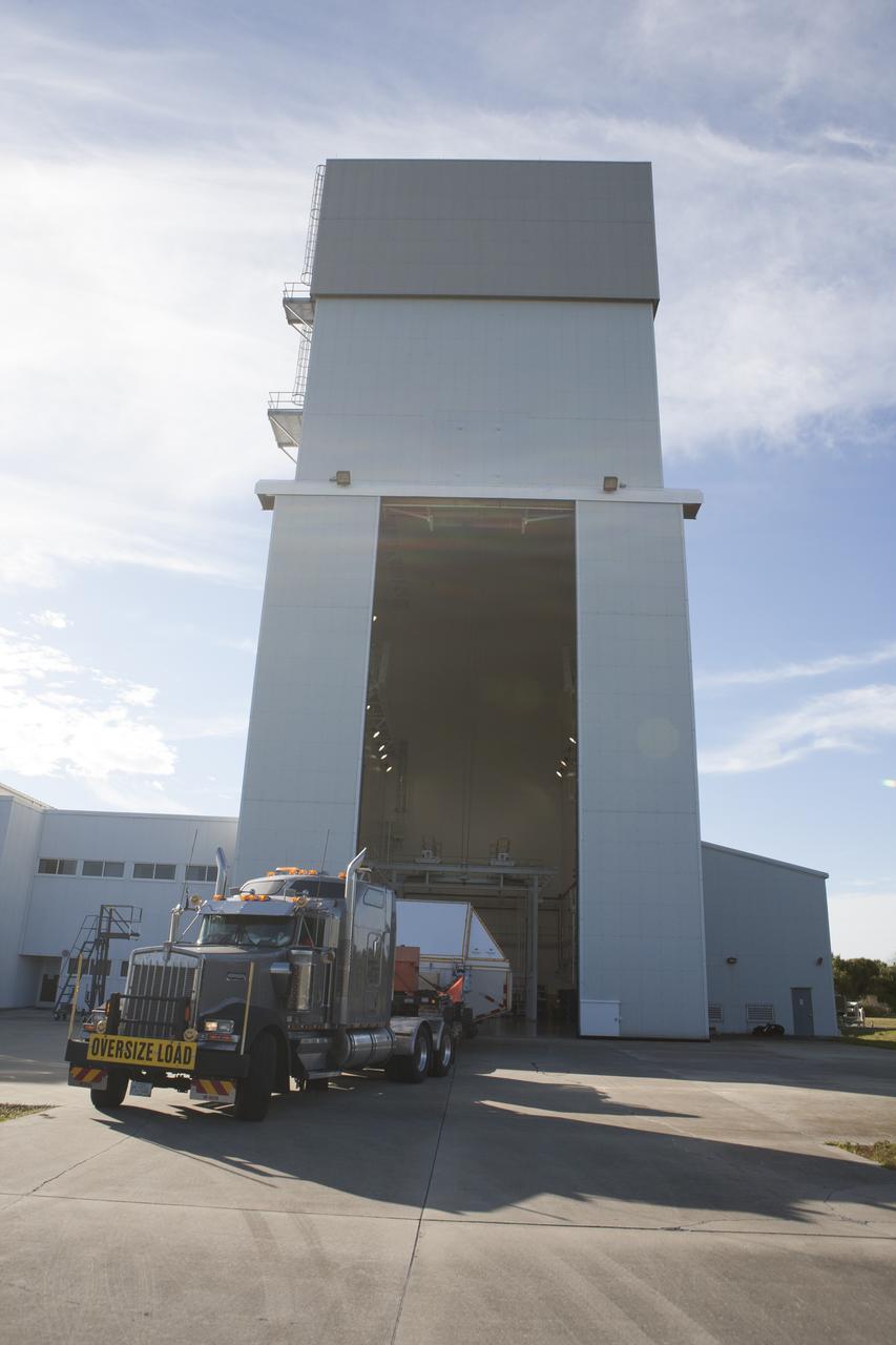 NASA's Orion spacecraft arrives at the Launch Abort System Facility at Kennedy Space Center in Florida. The spacecraft was transported 2,700 miles overland from Naval Base San Diego in California, on a flatbed truck secured in its crew module transportation fixture for the trip. During its first flight test, Orion completed a two-orbit, four-and-a-half hour mission Dec. 5 to test systems critical to crew safety, including the launch abort system, the heat shield and the parachute system. The Ground Systems Development and Operations Program led the recovery, offload and transportation efforts.