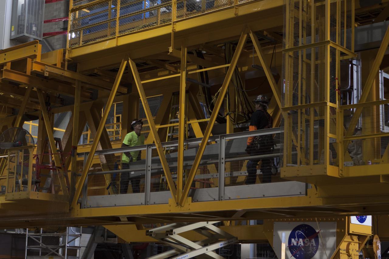 Inside the Vehicle Assembly Building at NASA's Kennedy Space Center in Florida, construction workers continue with refurbishment and upgrades to the 175-ton crane on the ground floor of the transfer aisle. The crane's 45-year-old controls are being upgraded to improve reliability, precision and safety. The Ground Systems Development and Operations Program is overseeing upgrades and modifications to the crane so that it can support lifting needs for NASA and other exploration vehicles, including the agency's Space Launch System and Orion spacecraft.