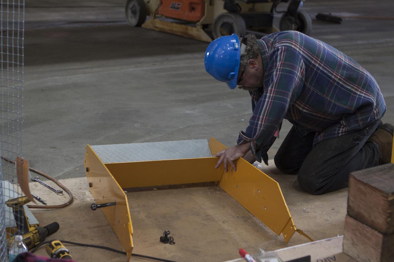 Inside the Vehicle Assembly Building at NASA's Kennedy Space Center in Florida, a construction worker continues with refurbishment and upgrades to parts of the 175-ton crane on the ground floor of the transfer aisle. The crane's 45-year-old controls are being upgraded to improve reliability, precision and safety. The Ground Systems Development and Operations Program is overseeing upgrades and modifications to the crane so that it can support lifting needs for NASA and other exploration vehicles, including the agency's Space Launch System and Orion spacecraft.