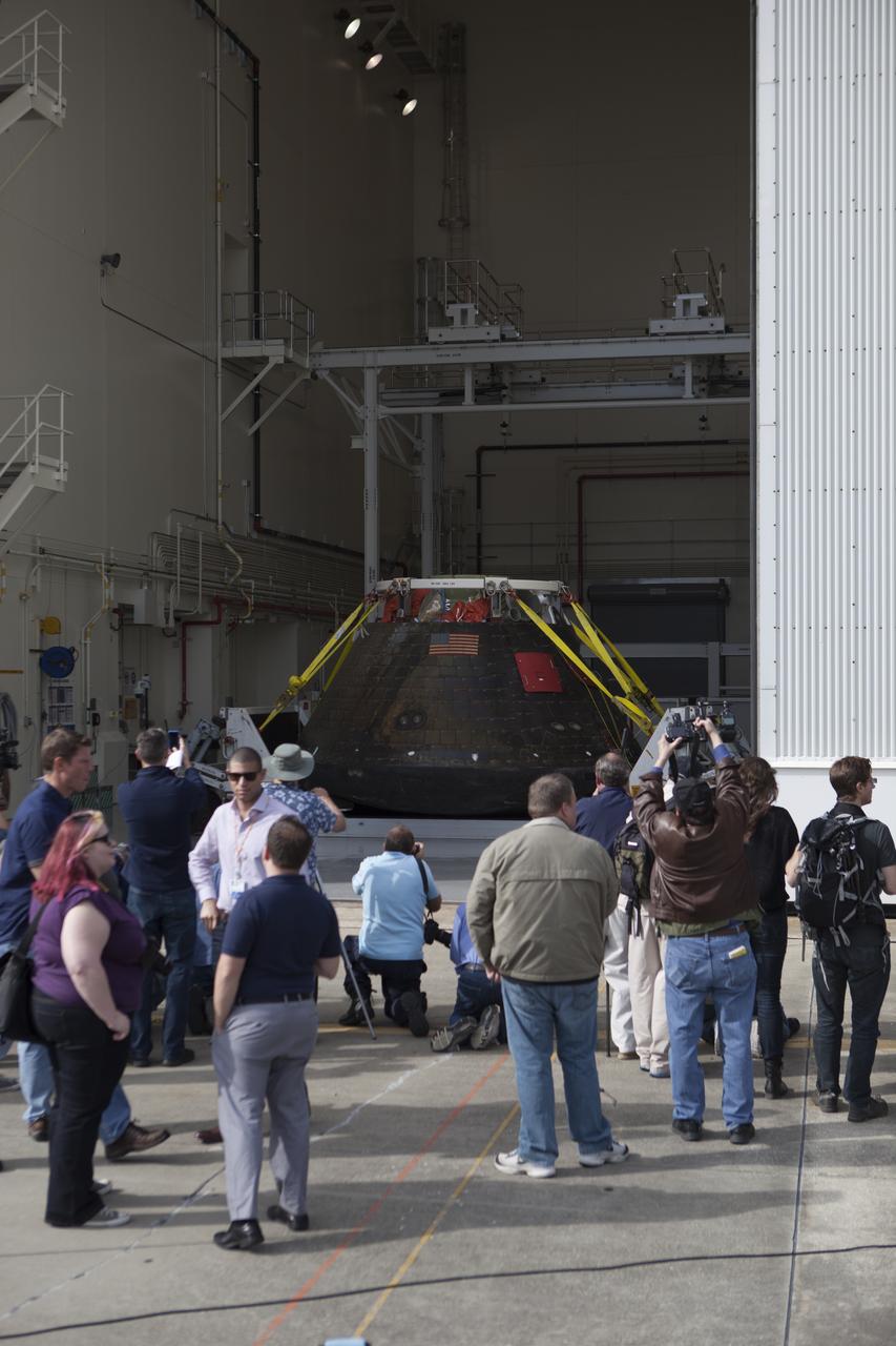 NASA's Orion spacecraft is viewed by members of the media at the Launch Abort System Facility at NASA's Kennedy Space Center in Florida. Orion made the 8-day, 2,700 mile overland trip back to Kennedy from Naval Base San Diego in California. Analysis of date obtained during its two-orbit, four-and-a-half hour mission Dec. 5 will provide engineers detailed information on how the spacecraft fared. The Ground Systems Development and Operations Program led the recovery, offload and transportation efforts.