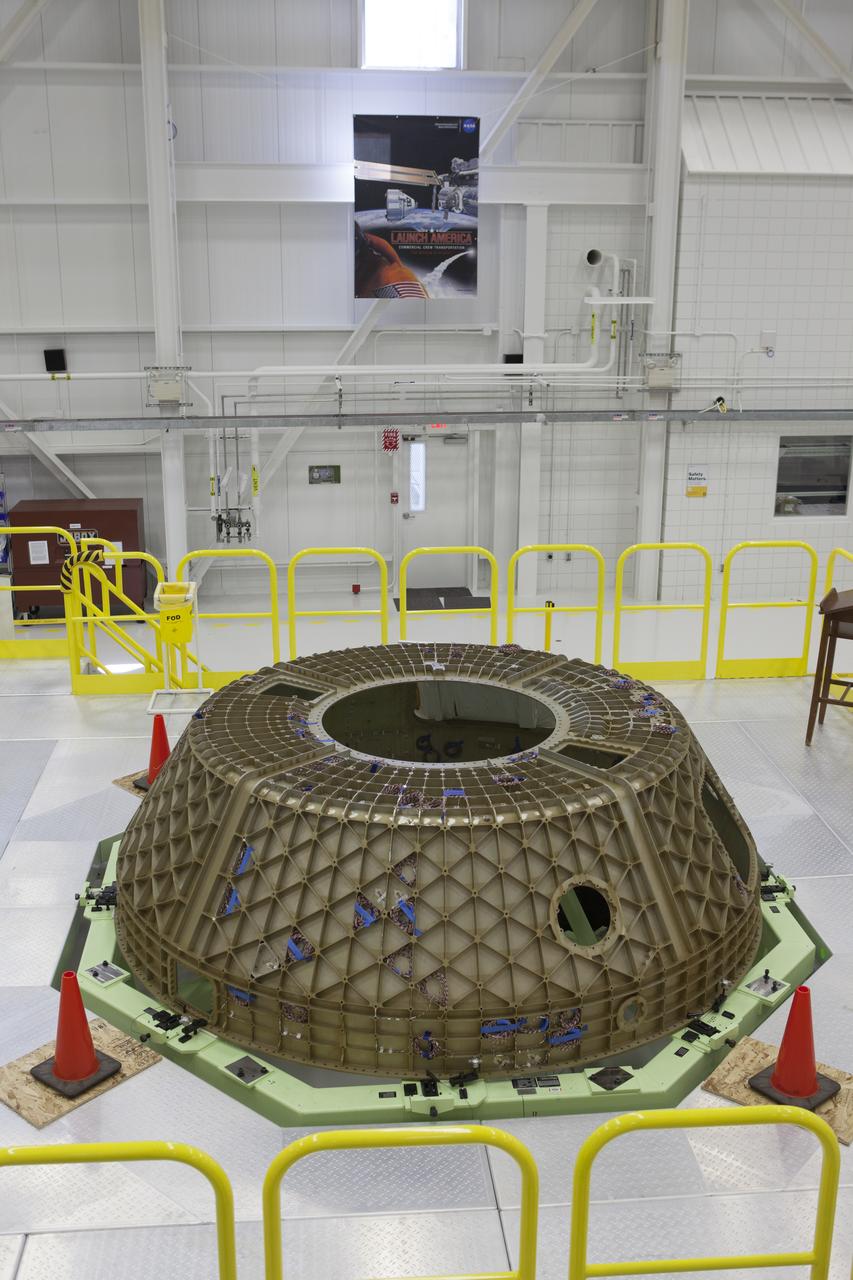 The upper dome of the Boeing CST-100 Structural Test Article awaits testing inside the Commercial Crew and Cargo Processing Facility, or C3PF, at NASA’s Kennedy Space Center in Florida. The test article will serve as a pathfinder for assembling and processing operational CST-100 spacecraft inside the revitalized facility, which for 20 years served as a shuttle processing hangar.