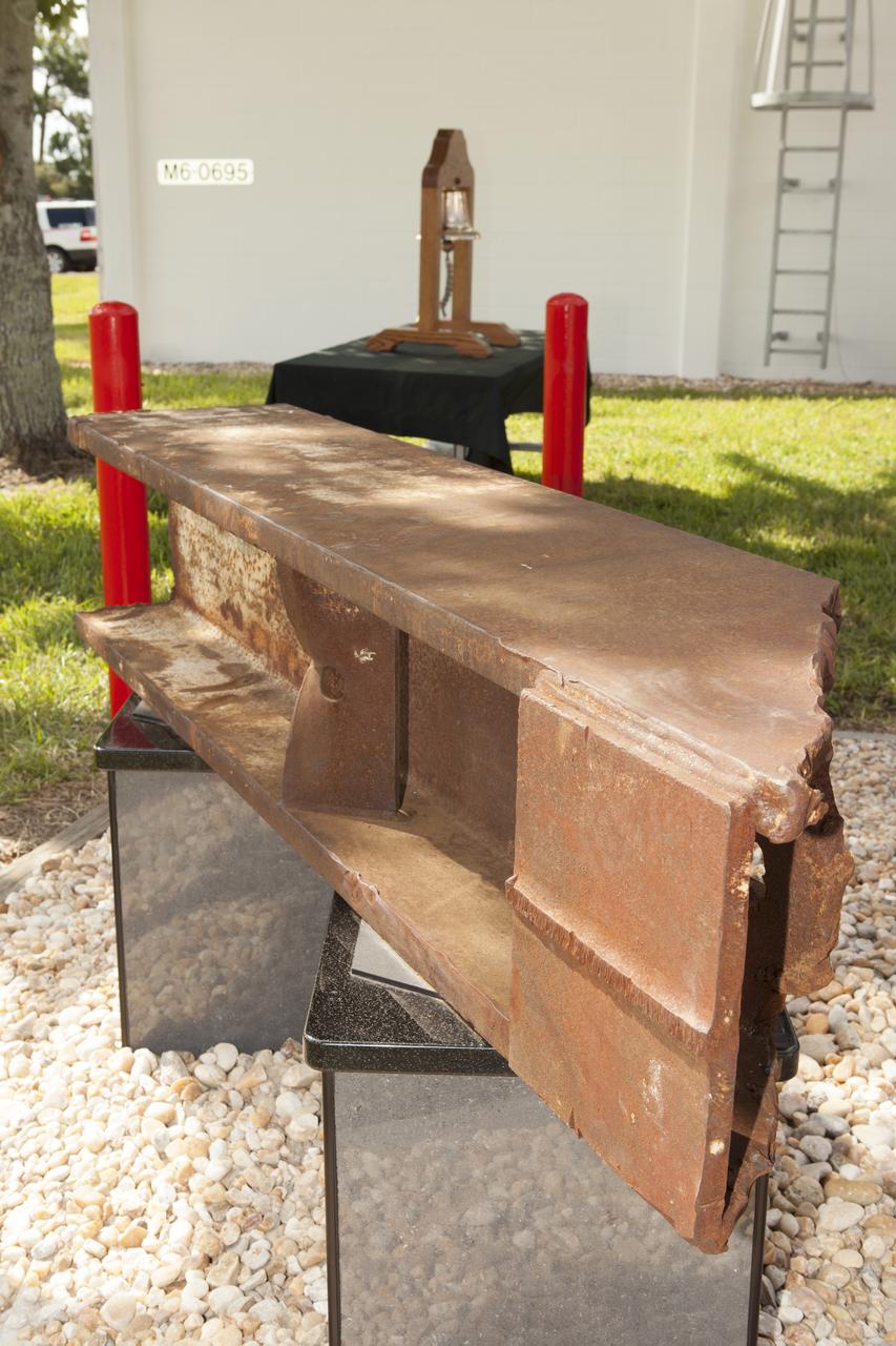 A memorial to the 343 first responder victims of the Sept. 11, 2001, terror attacks stands at Fire Station 1 at NASA's Kennedy Space Center during its dedication on Sept. 11, 2015. A section of steel I-beam from the World Trade Center in New York forms the centerpiece of the monument. 