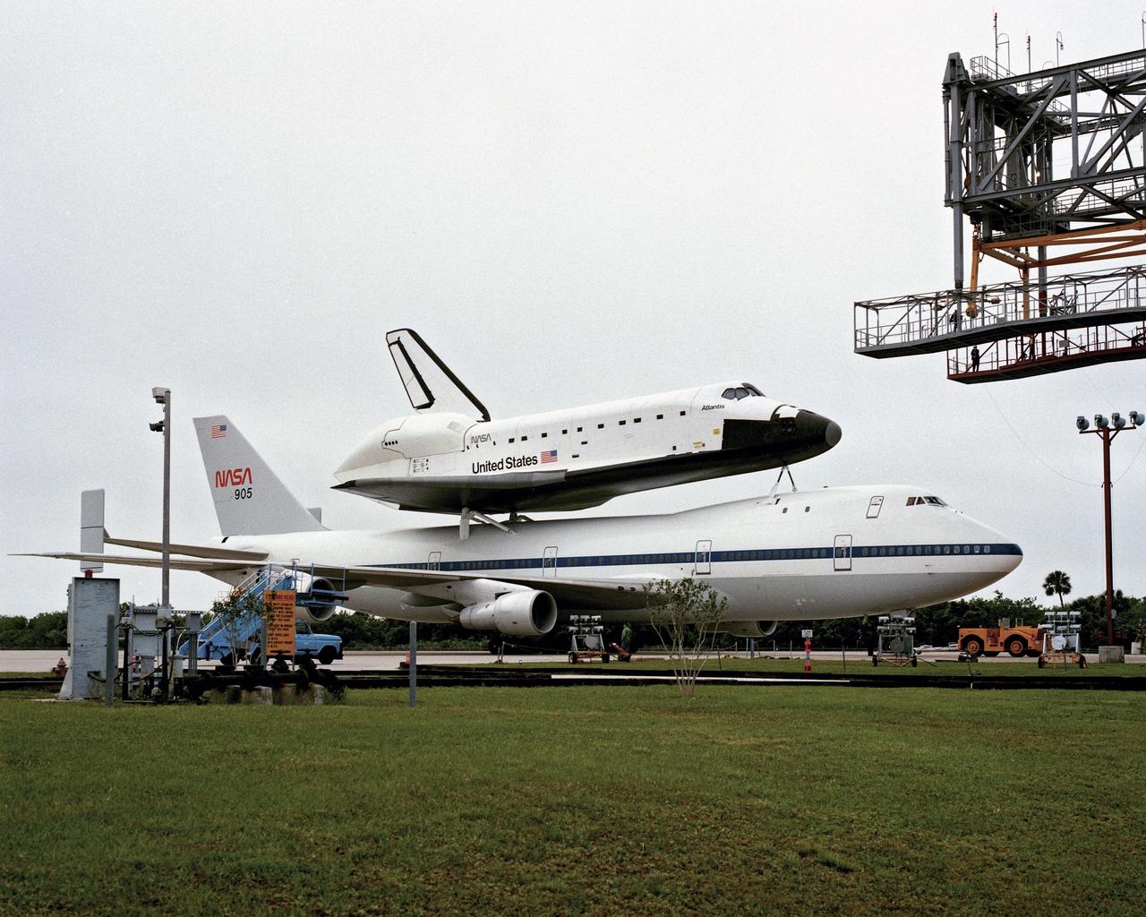 CAPE CANAVERAL, Fla. – At the Kennedy Space Center in Florida, the new space shuttle, Atlantis, arrives at the Shuttle Landing Facility. The shuttle is mounted atop the Shuttle Carrier Aircraft, a modified Boeing 747. Over the next seven months Atlantis will be prepared for its maiden voyage, STS-51J.      Atlantis, NASA's fourth space-rated shuttle, was named after the two-masted boat that served as the primary research vessel for the Woods Hole Oceanographic Institute in Massachusetts from 1930 to 1966. The boat had a 17-member crew and accommodated up to five scientists who worked in two onboard laboratories, examining water samples and marine life. Like its predecessors, Atlantis was constructed by Rockwell International in Palmdale, Calif. The spacecraft was transported over land from Palmdale to Edwards Air Force Base on April 3, 1985 for the cross-country ferry flight to Kennedy. For more: http://www.nasa.gov/centers/kennedy/shuttleoperations/orbiters/atlantis-info.html Photo credit: NASA/Louie Rochefort