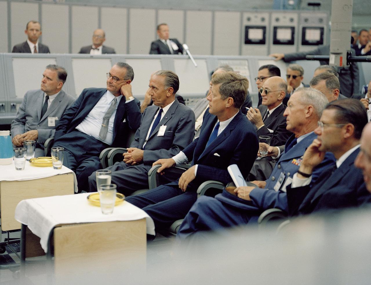 CAPE CANAVERAL, Fla. -- In the blockhouse of Launch Complex 34 at the Cape Canaveral Missile Test Annex in Florida, President John F. Kennedy is briefed on NASA's future plans. Seated, from the left, are NASA Administrator James E. Webb, Vice President Lyndon B. Johnson, Launch Operations Center Director Kurt H. Debus and Kennedy. Photo Credit: NASA