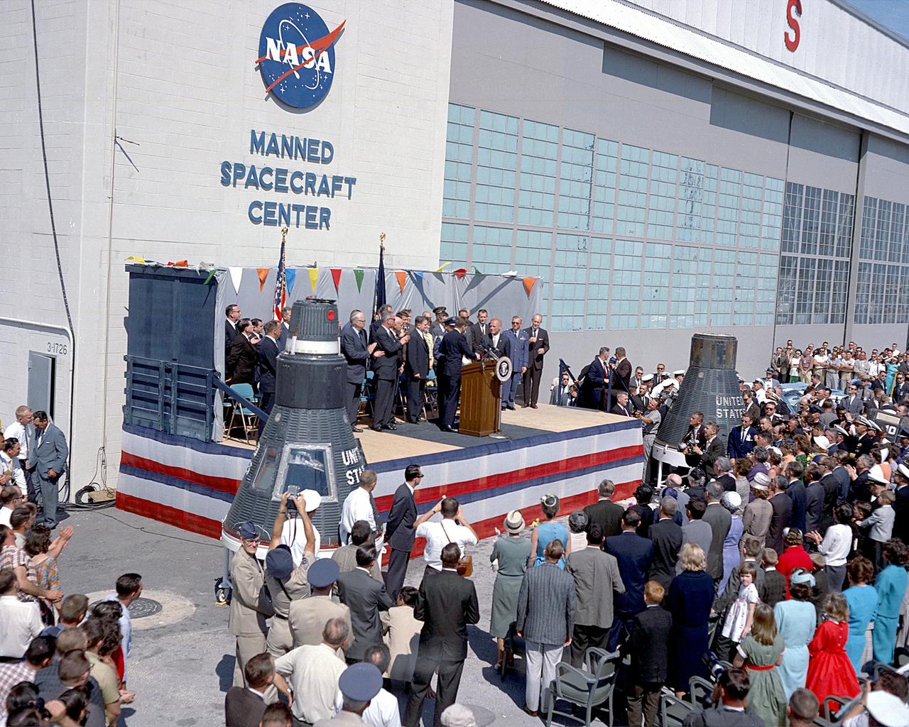 CAPE CANAVERAL, Fla. -- President John F. Kennedy honors John H. Glenn Jr. at Hangar S, Cape Canaveral, Florida, after his historic three-orbit mission aboard Friendship 7. Photo credit: NASA