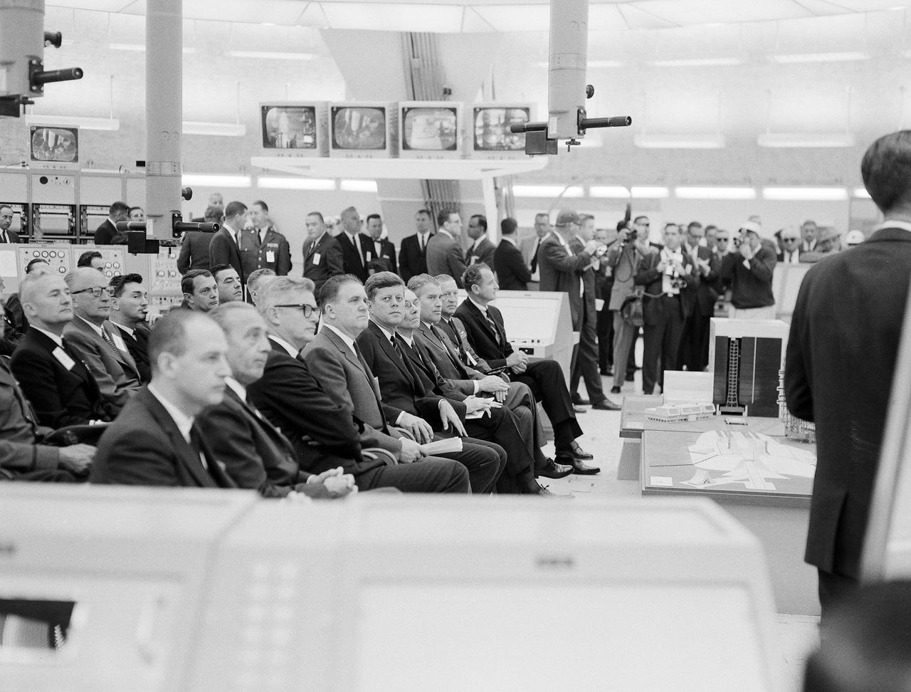 CAPE CANAVERAL, Fla. -- At Cape Canaveral Missile Test Annex in Florida, President John F. Kennedy and other officials are briefed on NASA's future plans in the blockhouse of Launch Complex 37. Photo Credit: NASA