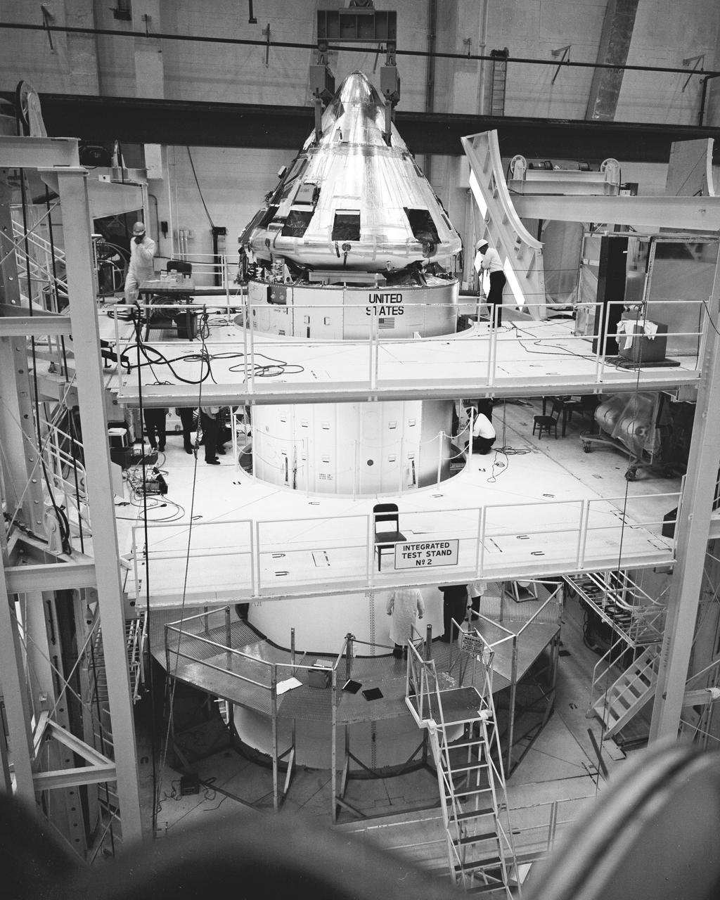 The Apollo/Saturn 501 spacecraft undergoes checkout in test stand within the Kennedy Space Center’s Manned Spacecraft Operations Building in preparation for the first flight of NASA’s Saturn V space vehicle in the second quarter of this year.  The command module, top, was mated to the service module, and both were joined to the Spacecraft Lunar Module Adapter, the type that eventually will house a Lunar Module.  The first Saturn V flight will be unmanned.