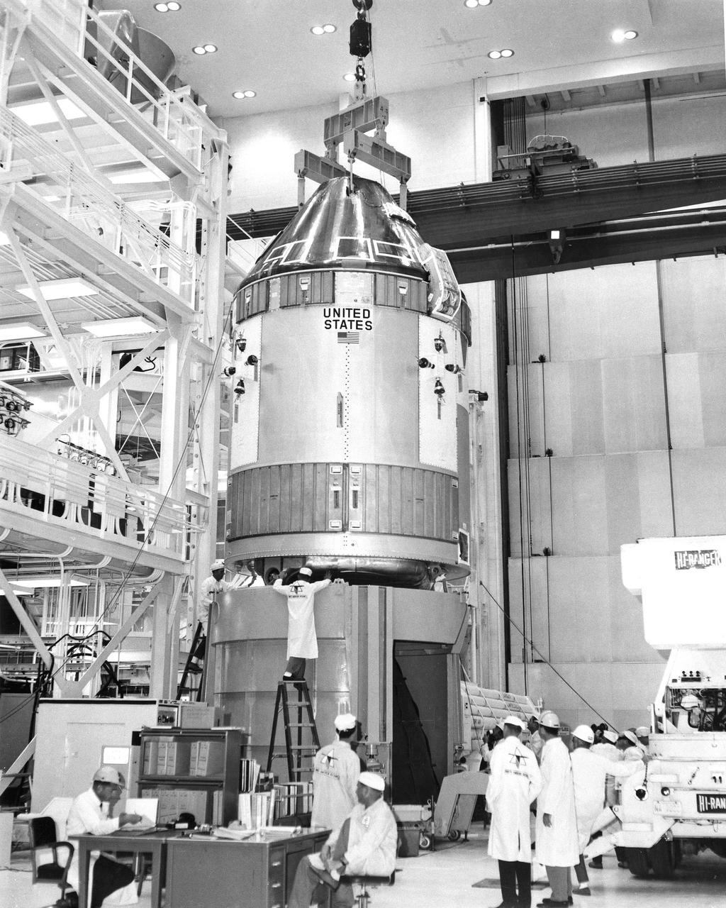CAPE CANAVERAL, Fla. – The Apollo 7 spacecraft - Spacecraft 101 - is lifted out of the vacuum chamber today following successful manned test runs in the spaceport's Manned Spacecraft Operations Building. The spacecraft, which will be the first Apollo to be flown with a crew, was moved to a work stand in the MSOB for further fitting out before being taken to Launch Pad 34 on Cape Kennedy. There it will be mated to its Saturn 1B launch vehicle. Photo credit: NASA
