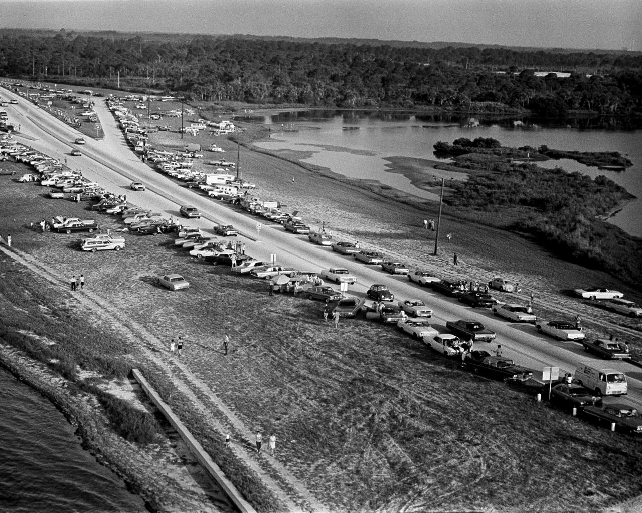 CAPE CANAVERAL, Fla. -- Thousands of persons lined roads adjacent to the Kennedy Space Center today to watch the launch of Apollo 11 astronauts Neil A. Armstrong, Michael Collins and Edwin E. Aldrin Jr. on the nation's first manned lunar landing mission. Their Apollo_Saturn V space vehicle lifted off at 9:32 a.m. EDT July 16, 1969, from the Kennedy Space Center's Launch Complex 39A. Photo credit: NASA