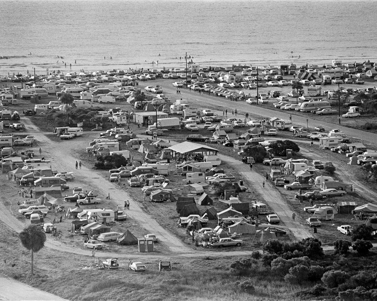 CAPE CANAVERAL, Fla. -- Thousands of persons spent the night before the Apollo 11 launch in tents, campers, automobiles, and on beaches and roads adjacent to the Kennedy Space Center. In all, an estimated 1,000,000 persons visited the Spaceport area to view the historic launch. Photo credit: NASA